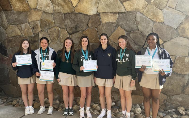 Submitted photo. Lily Gaglio (from left), Emily Cai, Raegan Duncan, Caroline Smith, Megan Prince, Gracie Gunter, and Joliet Okoronkwo bring home awards from TomeCon 2025.