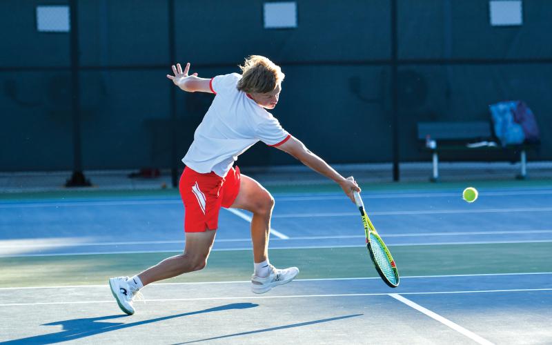Wade Cheek/The Clayton Tribune. RCHS sophomore No. 2 singles player Landan Bedingfield returns a serve in last week’s region championship match against Athens Academy. Bedingfield lost in the region title, but rebounded with a first-round playoff win, defeating his Jasper County opponent (6-0, 6-1).