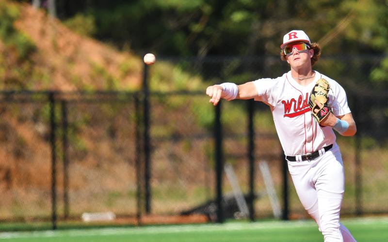 Wade Cheek/The Clayton Tribune. Wildcat freshman shortstop Chase Alonso fires across the diamond for a put-out in Rabun’s doubleheader sweep of Oglethorpe County on Friday, April 18.
