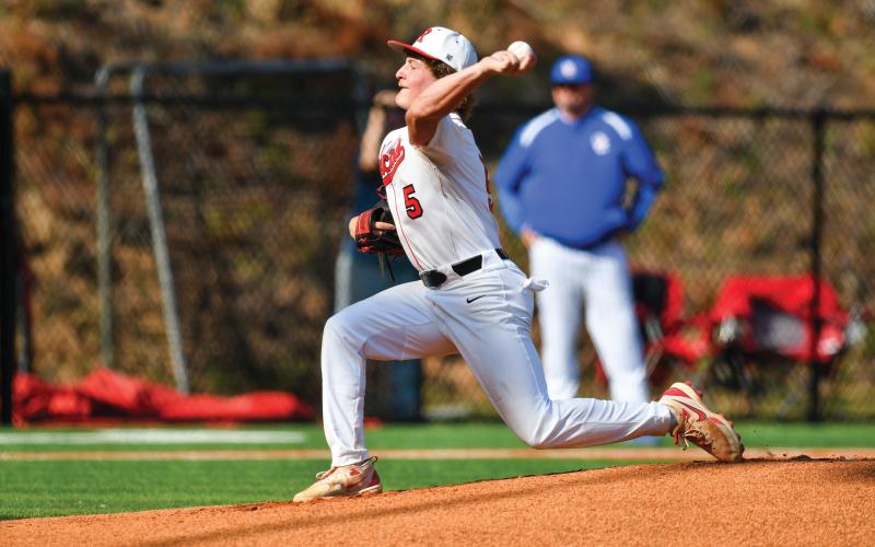Wade Cheek/The Clayton Tribune. RCHS junior pitcher Reid Giles strides down the mound for a strike in Rabun’s 8-6 win over Oglethorpe County on April 18. Giles completed five innings of work, striking out three and allowing two earned runs.