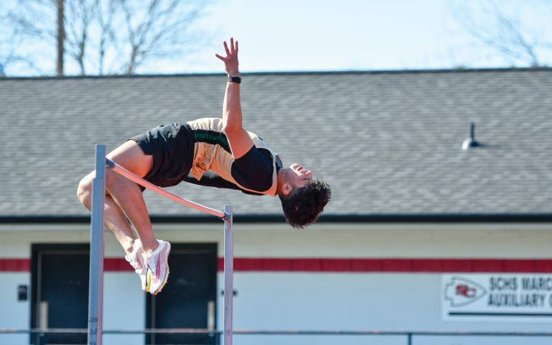 Wade Cheek/The Clayton Tribune. Senior JP Orozco soars over the bar in the boys high jump at Stephens County High School on Thursday, March 27.