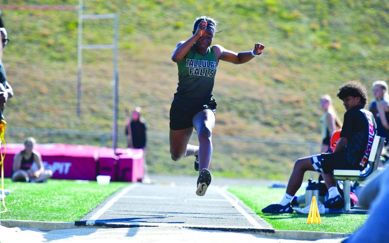 Wade Cheek/The Clayton Tribune. TFS senior Jace Ibemere set a personal-record (16-8.5) in the girls long jump at Stephens County High School on Thursday, March 27.