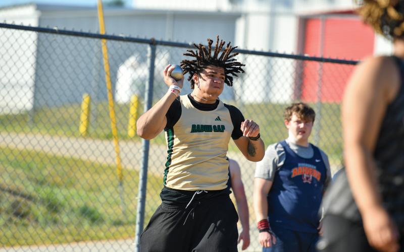 Wade Cheek/The Clayton Tribune. Elijah Hutcheson completes one of his attempts in the shot put during last week’s meet in Stephens County on Thursday, March 27. The RGNS boys won the meet with 114 team points.