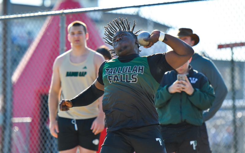 Wade Cheek/The Clayton Tribune. Senior Ade Akisanya fires a shot into the distance for a first-place showing in the boys shot put during last week’s meet at Stephens County High School. Akisanya finished with a top mark of 47-1.