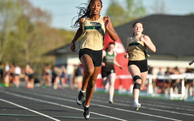 Wade Cheek/The Clayton Tribune. Kada Augustin (left) and Cassidy Klimasewski (right) finished second and eighth in the girls 100-meter dash, respectively, in last Thursday’s meet at Stephens County High School.