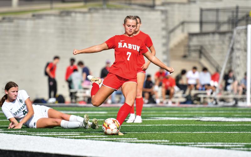 Wade Cheek/The Clayton Tribune. RCHS senior Kenzie Stout fires a pass during last Thursday’s region loss to Athens Academy. The Lady Cats finished region play with a 3-4 record.