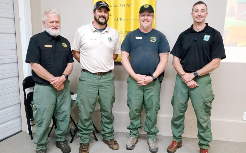 Pictured are Byron Haire, Lead Public Information Officer (PIO) for the Southern Area Gold Incident Management Team; Brent Saulsbury, Engine Boss and PIO for the Chattahoochee-Oconee National Forest; Jeffrey Schardt, district fire management officer for the United States Department of Agriculture (USDA) Forest Service; and Anthony English, Community Wildlife Defense Grant Coordinator for the Georgia Forestry Commission.