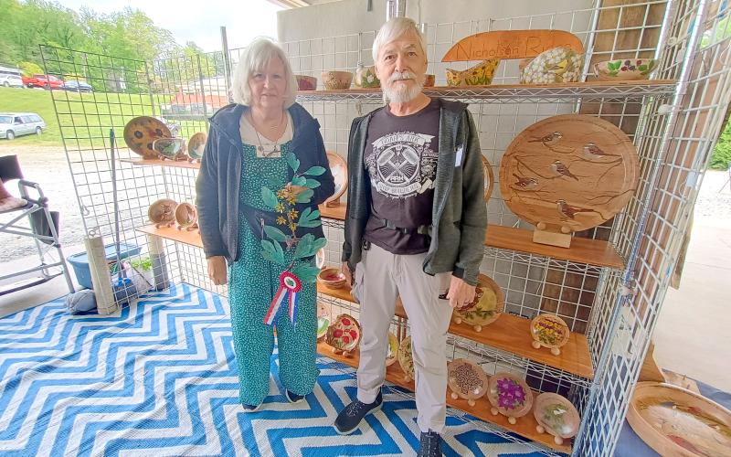 Megan Horn/The Clayton Tribune.  2025 Sassafras Artisan Market Award Best in Show winners were Kenneth and Brenda Nicholson with their painted wooden designs.