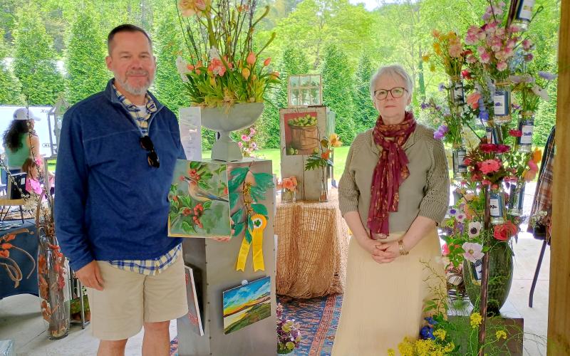 Megan Horn/The Clayton Tribune. The Judges’ Award went to Cyndi Israel and Peter Thornton with their intricate flower creations and beautiful, colorful paintings.