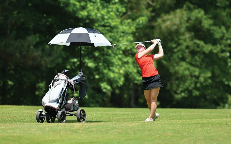 Wade Cheek/The Clayton Tribune. Rabun County freshman golfer Bella Hulsey strikes a fairway shot on the final hole of this year’s Class A-Division I state golf tournament. Huley finished 13th as an individual across the two-day tourney.