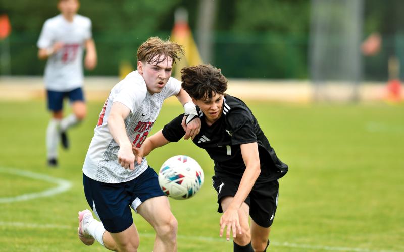 Wade Cheek/The Clayton Tribune. TFS senior Jackson Cording battles for possession during the Indians’ 3-1 semifinal loss to St. Anne-Pacelli on Saturday, May 24.