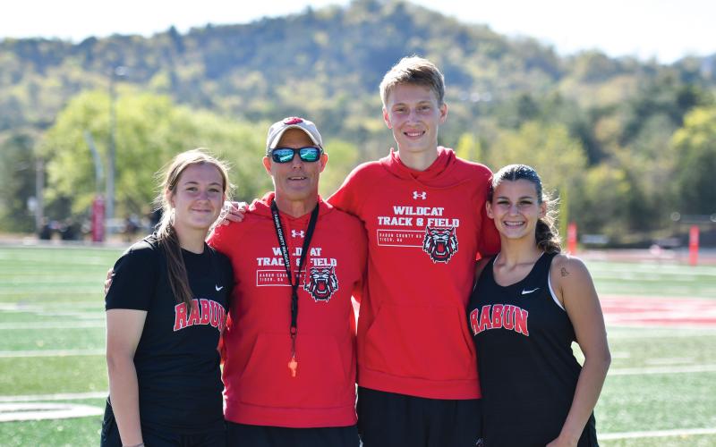 Wade Cheek/The Clayton Tribune. The RCHS track and field team held its senior night on Tuesday, April 15, honoring three seniors. Joined with head coach Tim Corbett are seniors (from left), Chloe Erlewine, G.B. Anderson and Arabella Kitchens. Not pictured are Clayton Blalock and Cameron Blalock.