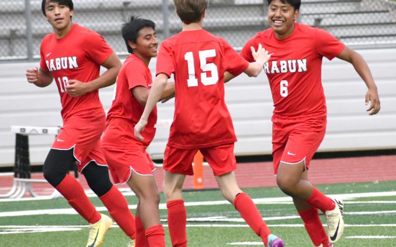 Enoch Autry/The Clayton Tribune. Rabun County junior Christian Avila (6) receives congratulations from his Wildcat teammates on April 25 after Avila scores his second goal of the game against Towers. RCHS won the playoff game 6-2 to advance to play Temple.