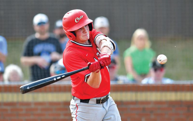 Wade Cheek/The Clayton Tribune. Senior first baseman Elvis Hunt cracks a double during Rabun’s playoff series with Bremen last Friday, April 25. The Wildcats lost 7-6 and 5-4, ending their season in the first round of the playoffs.