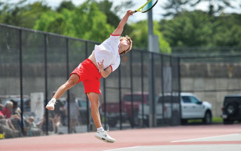 Wade Cheek/The Clayton Tribune. Sophomore No. 2 singles player Landan Bedingfield extends for a rocket serve in Rabun’s 3-0 win over Gordon Central on April 29. The Wildcats defeated the Warriors 3-0 to advance to the Class A-DI quarterfinals.