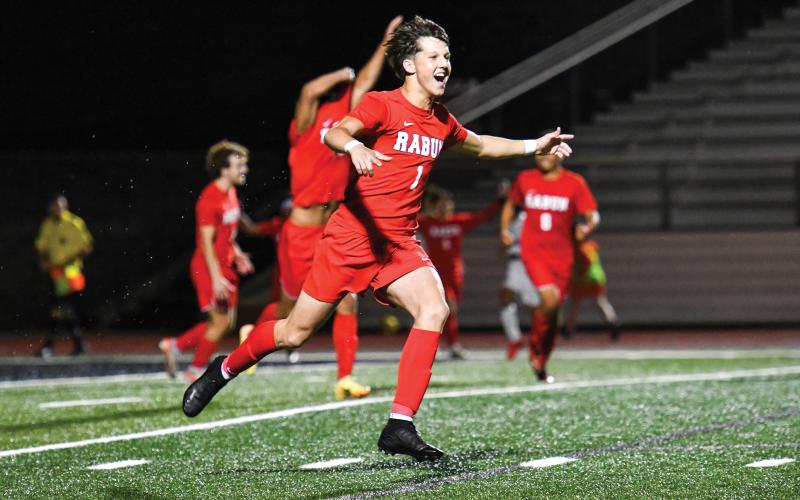 Wade Cheek/The Clayton Tribune. Soccer senior Clayton Blalock celebrates as the final buzzer sounds, marking Rabun County’s playoff quarterfinal berth after defeating Temple 1-0 on Friday, May 2.