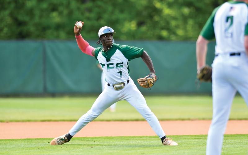 Wade Cheek/The Clayton Tribune.  Junior third baseman Ashton Roache completes a putout to first base in the Indians’ playoff loss to Stratford Academy. TFS ends the season with a 21-11 record.