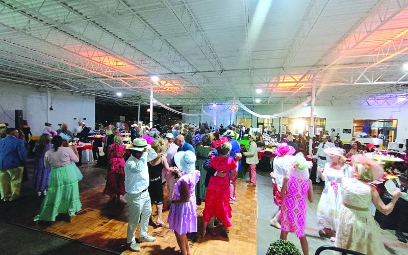 Megan Horn/The Clayton Tribune. There was much dancing at the Run for the Roses event held at the Food Bank of Northeast Georgia. Last weekend’s event was the Rotary Club of Clayton’s sixth annual fundraising gala.