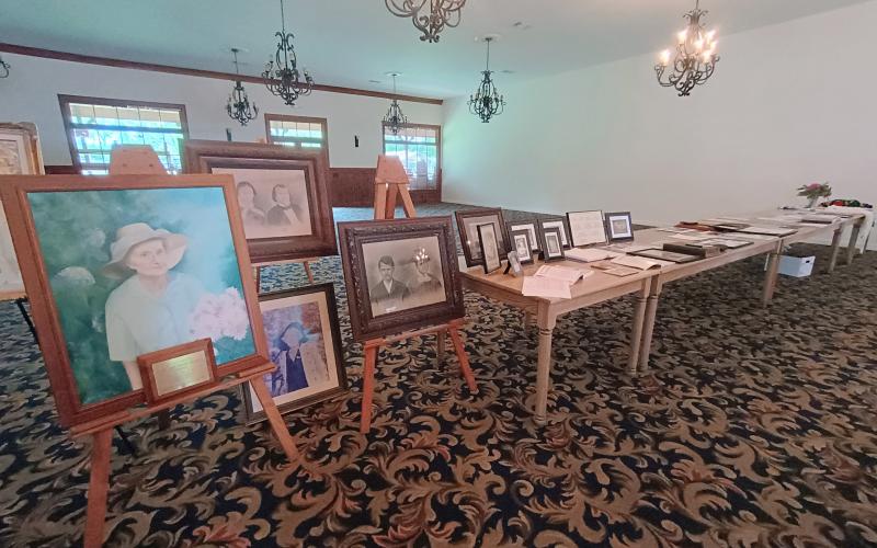 Megan Horn/The Clayton Tribune. Family members of the Dillard family reminisced about the past during the 2025 Dillard Family Association Reunion Saturday, April 26. Photographs and historical recordings were on display.