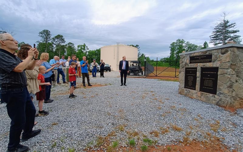 Megan Horn/The Clayton Tribune. Community members were present on May 19 as the Rabun County Water and Sewer Authority (RCWSA) unveiled a new 750,000 gallon ground-level water storage tank dedicated to the late Greg Peters, former vice-chairman of the RCWSA.