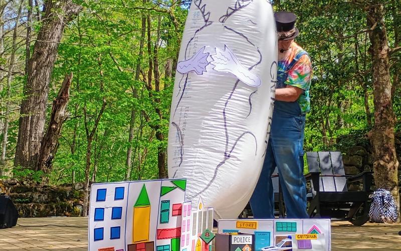 Megan Horn/The Clayton Tribune.  Rabun County local Charlie Dingler demonstrates his “Gritszilla” puppet show at the Hambidge Center Open House on Saturday, April 26.