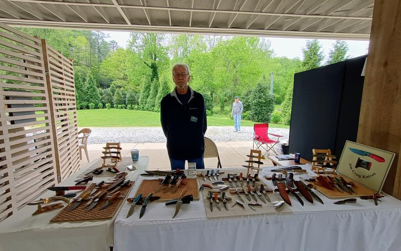 Megan Horn/The Clayton Tribune. Jim Craig displays his knives at Sassafras Artisan Market presented by the North Georgia Arts Guild last weekend.