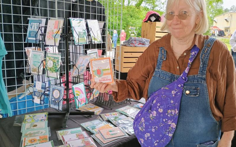 Megan Horn/The Clayton Tribune. Judy Marshall features these unique and beautiful cards for every occasion at the Of These Mountains MarketPlace recently. The cards were made by special needs adults through High Hopes Workshop.