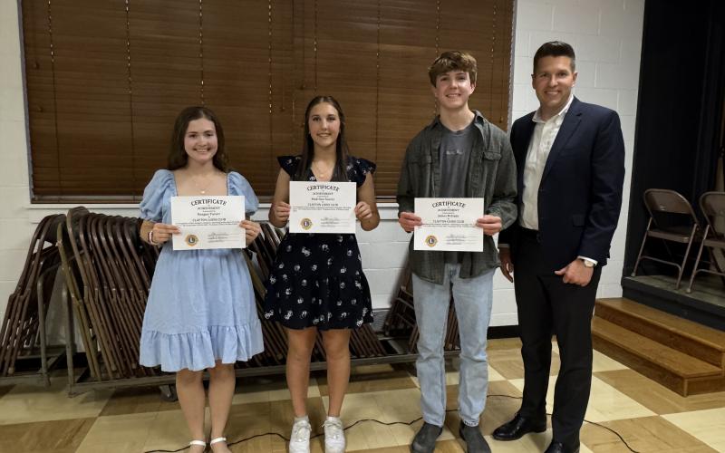 Submitted. 11th graders honored by the Clayton Lions Club are Reagan Turner, Madeline Suarez and James McDade pictured with Rabun County High School Principal Justin Spillers.