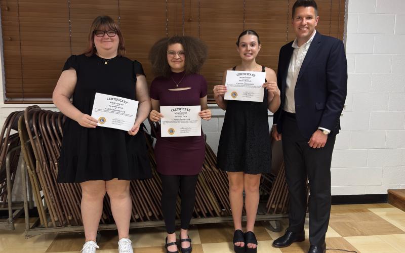 Submitted. Lions Club 12th graders: 12th graders honored by the Clayton Lions Club are Sarabeth Speed (left), Karleena Paris and Faith McDade pictured with Rabun County High School Principal Justin Spillers.
