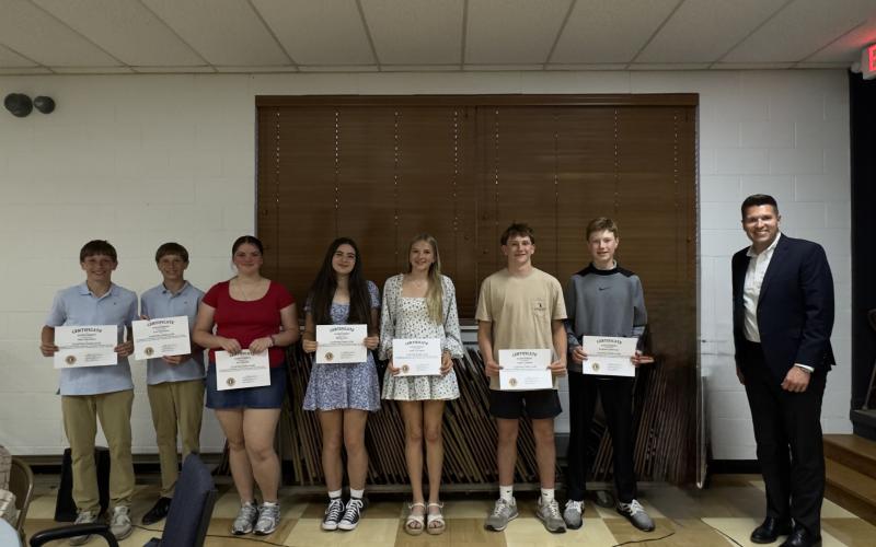 Submitted. Ninth graders honored by the Clayton Lions Club are Silas Stockton (left), Levi Stockton, Ava Sharpe, Mollie Istre, Lydia Gergeni, Colter Cannon and Graham Anderson pictured with Rabun County High School Principal Justin Spillers.
