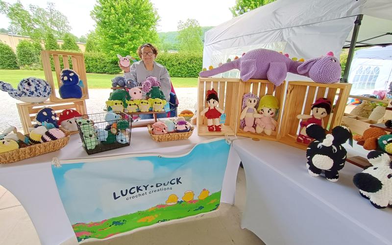 Megan Horn/The Clayton Tribune. Lanie Flin features intricate and handmade crochet animals at her business Lucky Duck Crochet Creations during last Saturday’s Of These Mountains Spring MarketPlace.