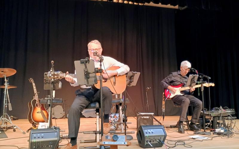 Megan Horn/The Clayton Tribune. Dr. Carl Lynn also performs music with David Bacon during the dinner portion of the evening at the Rabun Paws 4 Life Fur Ball. Sweet Charity’s Playing It Forward also performed during the event.
