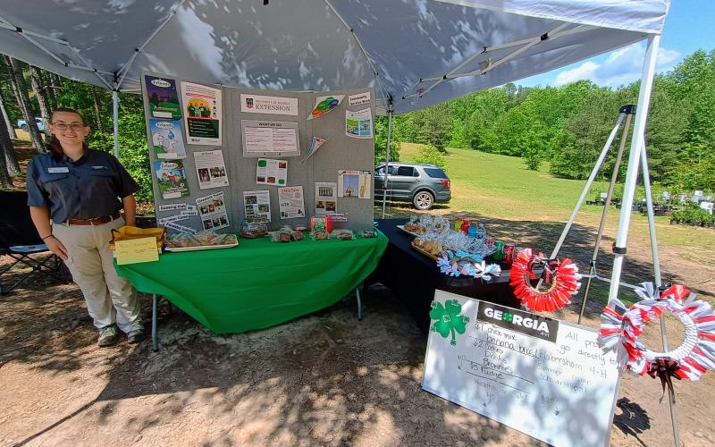 Megan Horn/The Clayton Tribune. Sydney Jackson, part-time program assistant for Habersham County 4-H, managed a bake sale during the Spring Plant Sale. Proceeds from the bake sale went to Habersham County 4-H helping send 13 kids to summer camp.