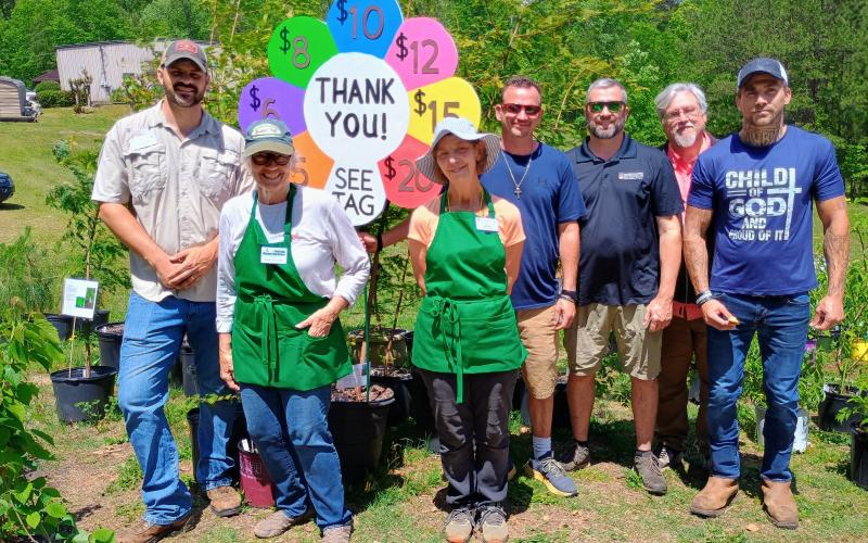 Megan Horn/The Clayton Tribune. Pictured are John Scaduto, Rabun County UGA Extension Coordinator; Nathan Eason, ANR agent/CEC for White County UGA Extension Office; Kathy Booker; Laura West; Steven Patrick, Habersham County UGA extension coordinator; Jonathan Twitty and Dalton Marks with Victory Home, who volunteered during the plant sale.