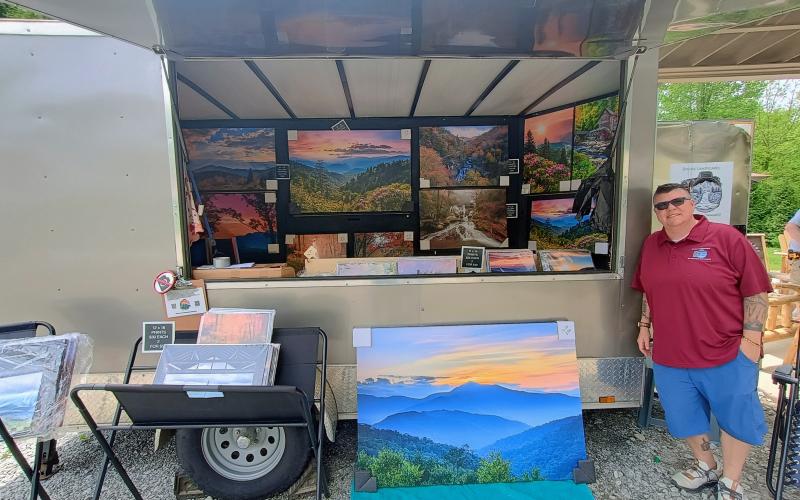 Megan Horn/The Clayton Tribune. Michele Schwartz with Divine Landscapes displayed her photography at the Sassafras Artisan Market last weekend.
