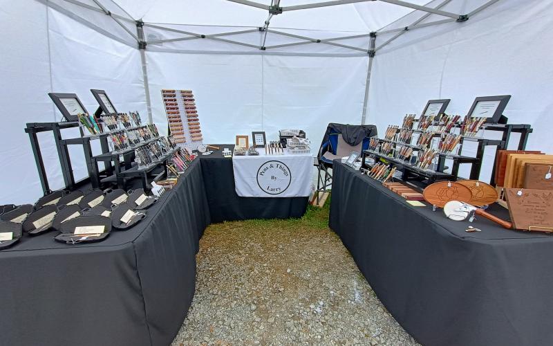 Megan Horn/The Clayton Tribune. Larry Ferguson creates beautiful wooden works of art including pens, pizza cutters, and other useful and unique items through his Tiger business Pens &amp; Things. He featured many of his works during last Saturday’s Of These Mountains Spring MarketPlace.
