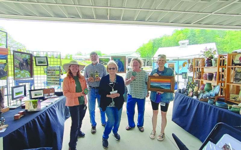 Megan Horn/The Clayton Tribune. Sassafras Artisan Market featured many creative artists from around the area. Macon County Art Association’s Uptown Gallery featured artists including Kathy Cooper with watercolor/painting; April McNiff with photography; Paul Pieringer with assemblage sculptures; Kay Wolf with pottery; and Kathleen Woodring with jewelry.