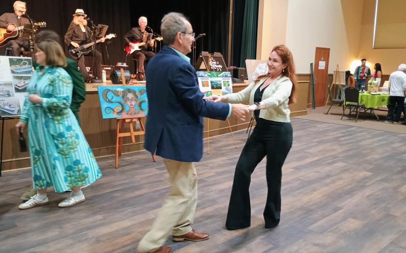 Megan Horn/The Clayton Tribune. Steven and Sheryl Webster enjoy music by Sweet Charity’s Playing It Forward and dancing during last weekend’s Fur Ball.