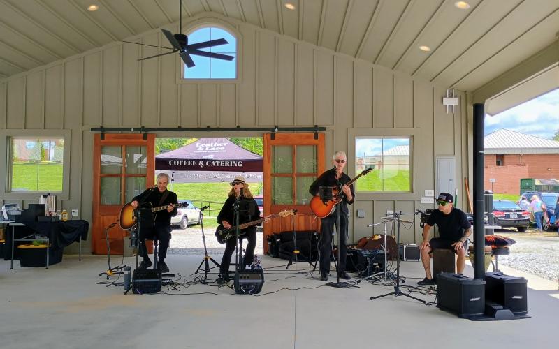 Megan Horn/The Clayton Tribune. Sweet Charity’s Playing It Forward performs at Dinglerfest 2025 May 3 and 4. The festival benefitted local nonprofit Sid Weber Memorial Cancer Fund. Pictured are Greg Presmanes, left; Karen Bacon; David Bacon; and Mark Tyson.