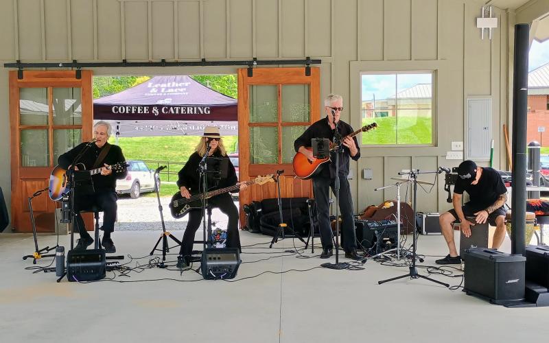 Megan Horn/The Clayton Tribune. Sweet Charity’s Playing It Forward performs at Dinglerfest 2025 May 3 and 4. The festival benefitted local nonprofit Sid Weber Memorial Cancer Fund. Pictured are Greg Presmanes, left; Karen Bacon; David Bacon; and Mark Tyson.