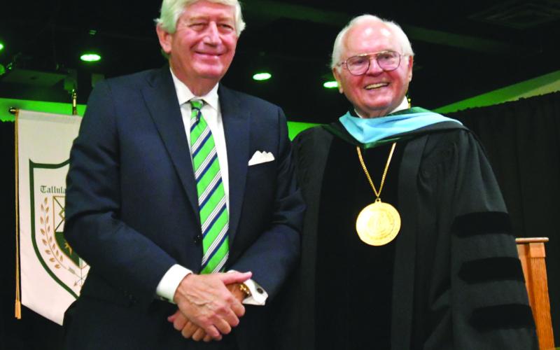 Enoch Autry/The Clayton Tribune. Dink NeSmith (left), co-owner of Community Newspapers, Inc. and the Class of 2025 graduation speaker, stands with Dr. Larry Peevy, TFS president and head of school, after the commencement exercises on May 22 in the Student Activity Center.