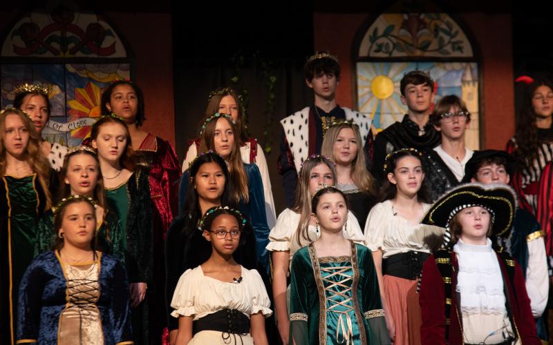 Photos courtesy TFS. TFS middle school students sing together as part of the 2025 Madrigal. Students bring acting, music, art, dance, and more to the yearly show.
