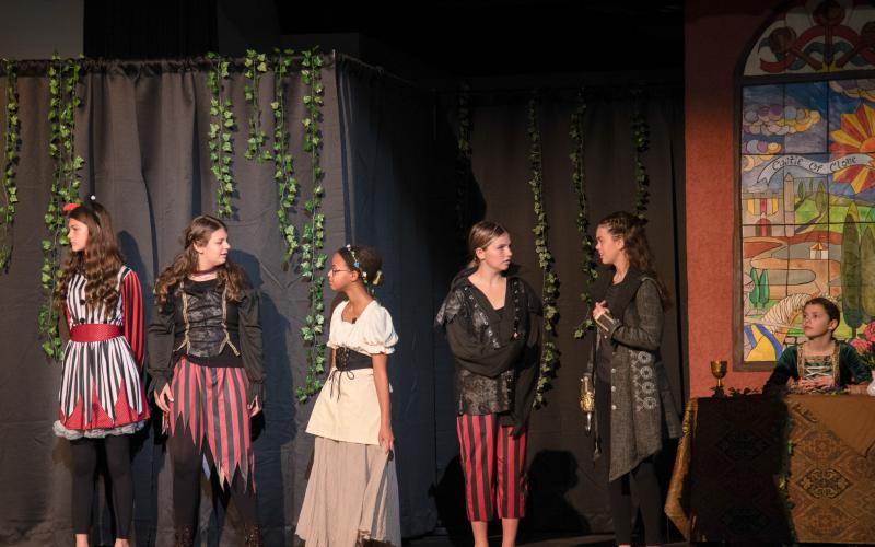 Photos courtesy TFS. TFS students Erin Sweat, Quinlan Flanders, Mitike Kohler, Lily Denard and Maeve Hatcher plot to thwart the pirates’ plans in the Madrigal.