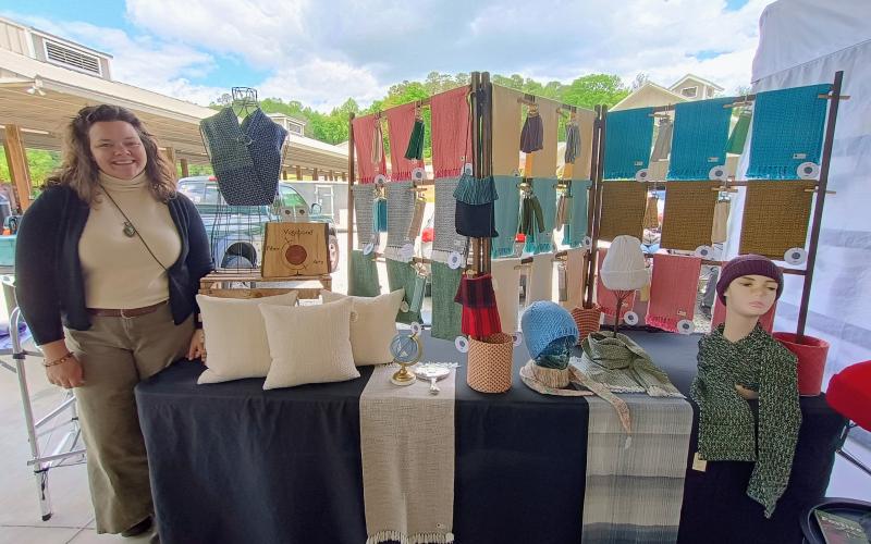 Megan Horn/The Clayton Tribune. Jordan Adams with Vagabond Fiber Arts creates knitted and woven goods. Adams is shown at Dinglerfest 2025 last weekend.