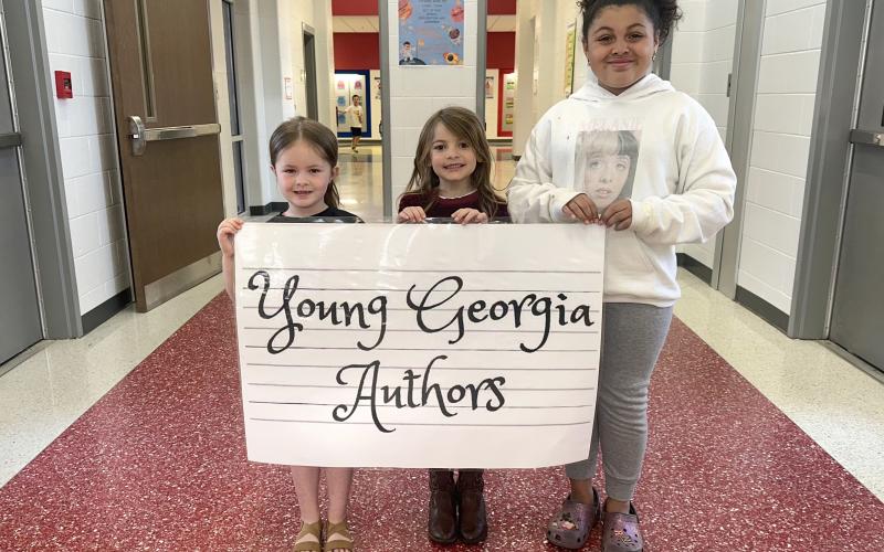 Photo courtesy Rabun County Schools. Young Georgia Author winners at Rabun County Primary School include kindergartener Maggie Long for “Disney Birthday;” first grader Sutton Stephens for “Super Sutty Snowgril;” and second grader Naya Tyler for “The Dimond Story.”