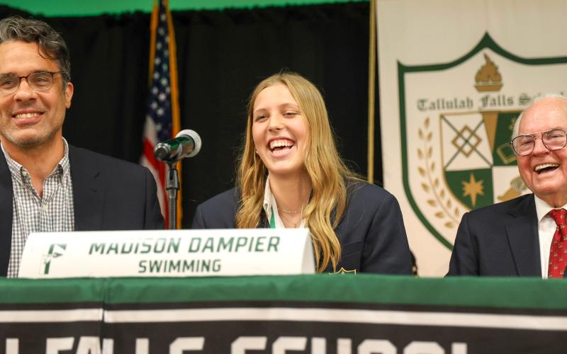 Wade Cheek/The Clayton Tribune. Madison Dampier has signed with the University of Cincinnati to swim for the Bearcats.