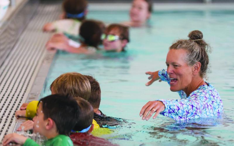 Landen Todd/The Northeast Georgian. Coach Amy Hood leads Tallulah Falls swim campers in a swimming exercise.