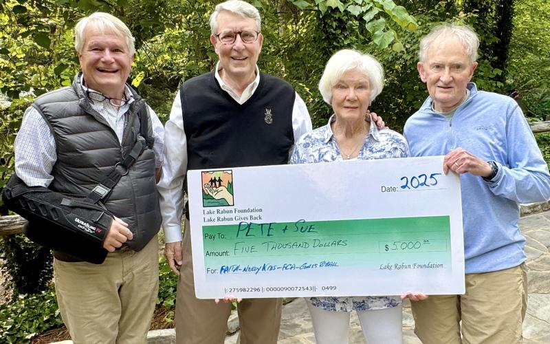 Photo courtesy of Richard Simms. Pictured are Buz Stone, who headed the LRA Foundation for 25 years and for whom the award is named, left; Pete Halter; Sue Halter; and Steve Raeber, executive director of the Lake Rabun Foundation. The Buz Stone Award was announced during the May 25 Lake Rabun Association (LRA) annual general membership meeting. Award recipients receive a $5,000 grant from the Lake Rabun Foundation to Rabun charities selected by the recipient.