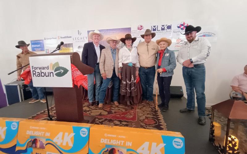 Megan Horn/The Clayton Tribune. Pictured are Forward Rabun Executive Committee Vice Chairman Robert Pittman, far left; Rick Story, president of Forward Rabun/Rabun County Chamber of Commerce; Best Western Couple winners Dwayne and Cecile Thompson; Forward Rabun Executive Committee Chairman Claude Dillard; Best Cowgirl Jan Ciochetti; and Best Cowboy Andy Strait. The winners received televisions donated by Walmart.