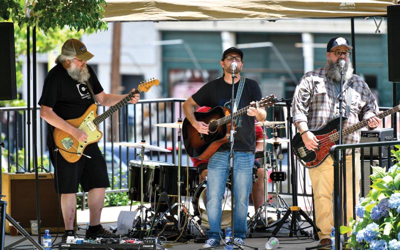 Wade Cheek/The Clayton Tribune. Musical group Drunk on the Wind was one of eight bands/artists to bring a lot of great music and sound to the downtown streets of Clayton last Saturday at the second-ever Ramshackle event.